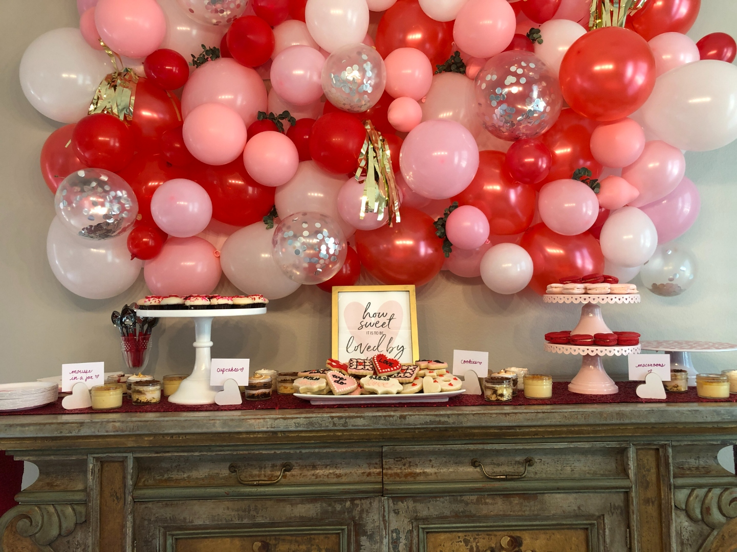 Oneder the Sea mermaid first birthday dessert table with balloon arch